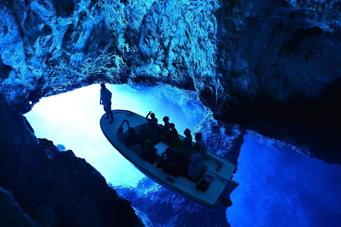 Blue Cave interior - electric blue light inside Biševo cave, Hvar boat tour