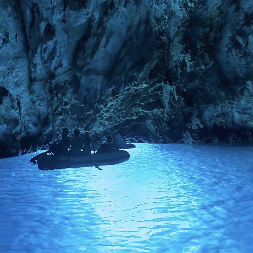 Inside Blue Cave Biševo near Hvar - turquoise light and boat