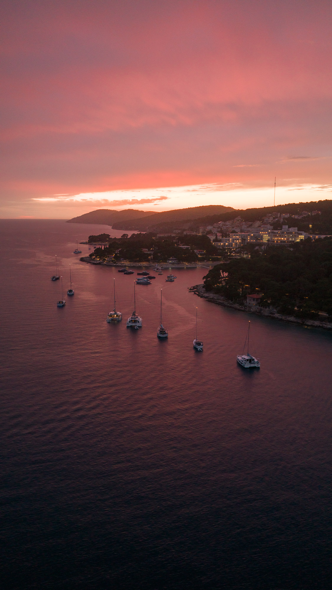 Pakleni Islands at dusk from drone - sunset cruise from Hvar Croatia